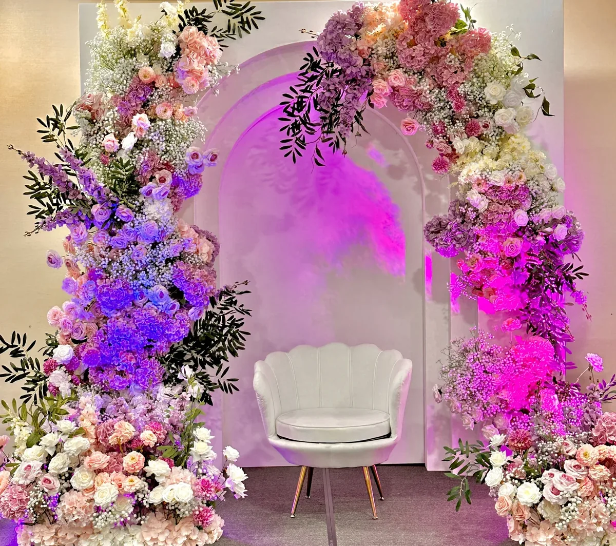 Floral arch with neon signage for a celebration